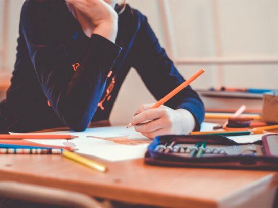 photo of teen student with pencil